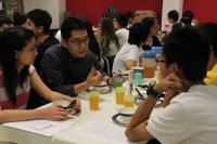 Mr. Terence Lam chatting with students during dinner